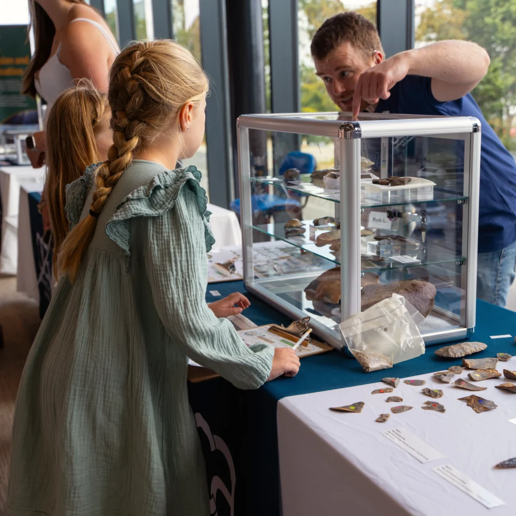 Rob explains the flint display to two young visitors