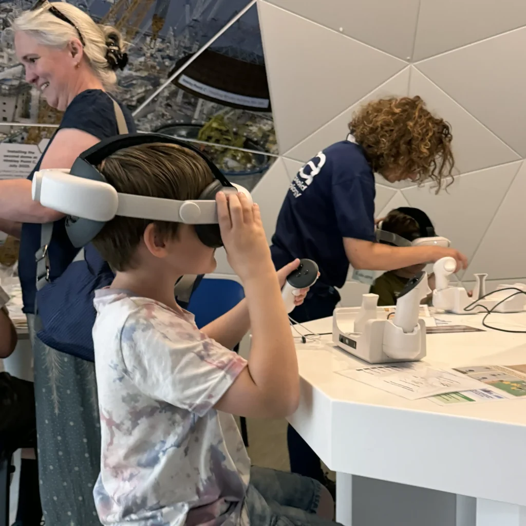 young boy adjusts VR headset